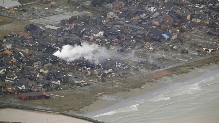 Kyodo News/AP